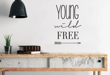 vinyl sticker, wall art of the words, "Young Wild Free " with a line drawn arrow.
